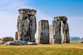Ancient Stonehenge stands majestically against a clear blue sky in the UK, a remarkable archaeological site | MSC Cruises