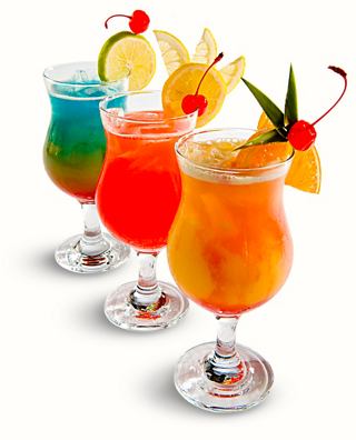 A selection of vibrant cocktails garnished with fruit, served in elegant glasses to enjoy on board | MSC Cruises