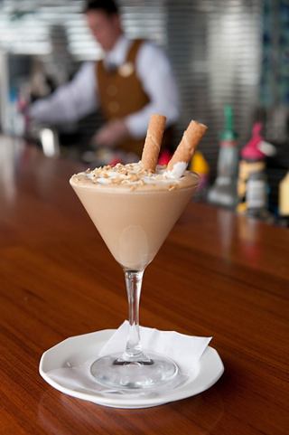 A delicious ice cream sundae served in a glass on a plate at a bar counter | MSC Cruises