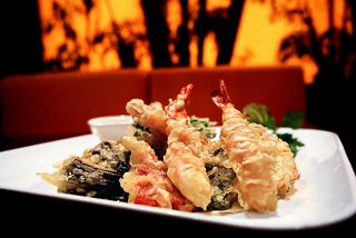 A beautifully presented dish of tempura seafood and vegetables from the Kaito Sushi Bar on MSC Musica | MSC Cruises