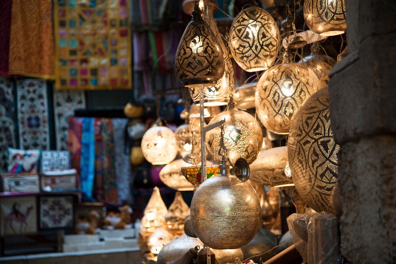 Egypt Cruises, a bustling market scene in Alexandria, showcasing vibrant lights and lamps | MSC Cruises