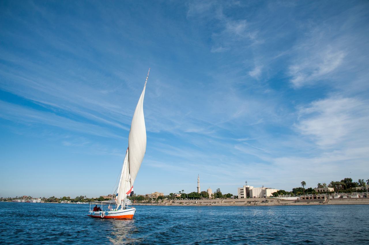 A traditional felucca sails gracefully on the Red Sea near Safaga, Egypt, with a clear blue sky above | MSC Cruises