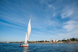 A traditional felucca sails gracefully on the Red Sea near Safaga, Egypt, with a clear blue sky above | MSC Cruises