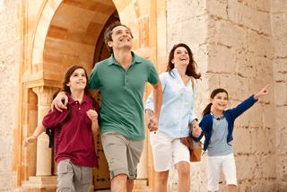A joyful family exploring historical sites in Tunisia, creating lasting memories together | MSC Cruises