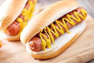 Delicious hotdogs with mustard served in soft bread, ready to enjoy on board | MSC Cruises