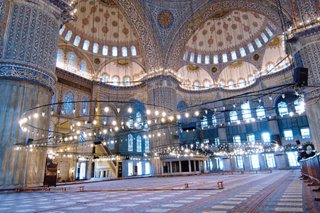 A spacious interior of a mosque in Istanbul featuring intricate design and beautiful carpets | MSC Cruises