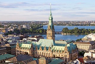 A scenic view of Hamburg's City Hall with the lake in the background, showcasing the city's vibrant atmosphere | MSC Cruises