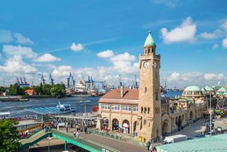 Cityscape of Hamburg featuring a clock tower and river in the background | MSC Cruises