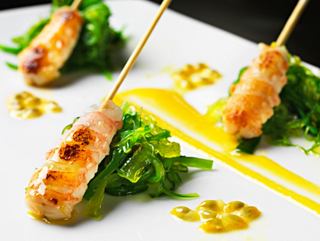 Delicious Shrimp Scampi Tataki served with fresh greens and vibrant sauce for an exquisite dining experience | MSC Cruises