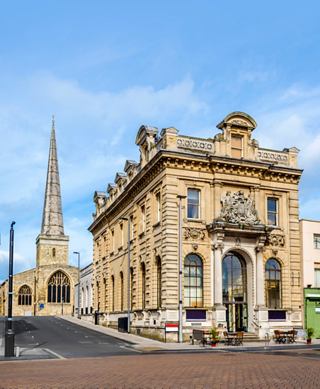 Historic building with a tall church spire in Southampton, inviting exploration of the vibrant city | MSC Cruises