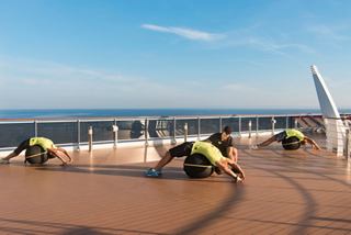 Guests enjoy a fitness training session on the deck of MSC Preziosa, embracing wellness and activity at sea | MSC Cruises