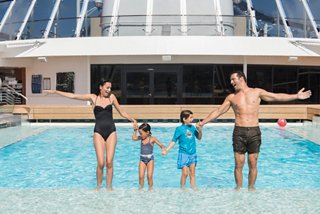 A family enjoys quality time together in The Garden Pool on MSC Preziosa | MSC Cruises
