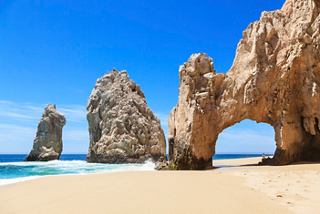 Stunning rock formations rise majestically from the sandy beach in Cabo San Lucas, inviting exploration and adventure | MSC Cruises