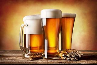 Three glasses of beer with frothy tops, set against a warm background, inviting you to enjoy a refreshing drink | MSC Cruises