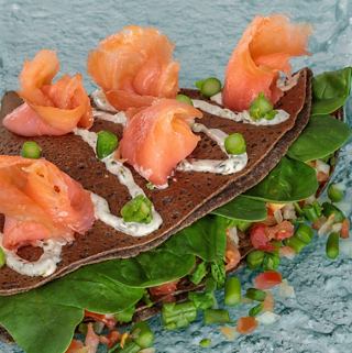 Savory crêpes filled with salmon and vegetables, beautifully presented and ready to enjoy | MSC Cruises