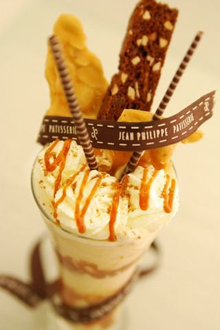 A delicious dessert featuring ice cream topped with chocolate, biscuits, and decorative elements | MSC Cruises