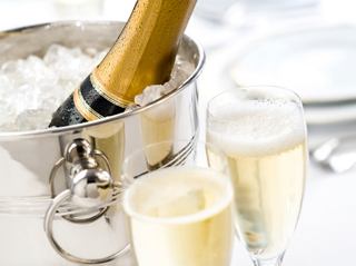 Chilled champagne in a bucket with flutes ready for a celebration | MSC Cruises