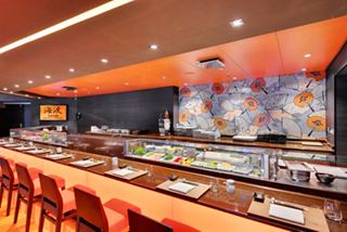 The inviting interior of Kaito Sushi Bar & Teppanyaki features a vibrant counter and seating for a delightful dining experience | MSC Cruises
