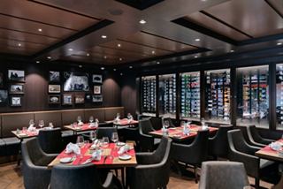 A stylish steakhouse restaurant aboard MSC Meraviglia, featuring elegant tables and a warm atmosphere | MSC Cruises