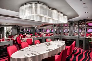 A vibrant dining area featuring elegant tables and chairs, perfect for enjoying a meal with loved ones | MSC Cruises