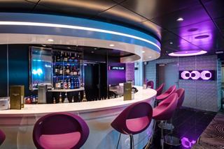 A vibrant bar area in the Attic Club on MSC Meraviglia, featuring stylish seating and modern decor | MSC Cruises
