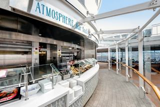 Inviting outdoor bar area offering food and drinks aboard MSC Meraviglia | MSC Cruises