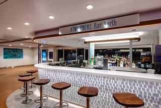Contemporary bar with comfortable seating, perfect for socializing with friends | MSC Cruises