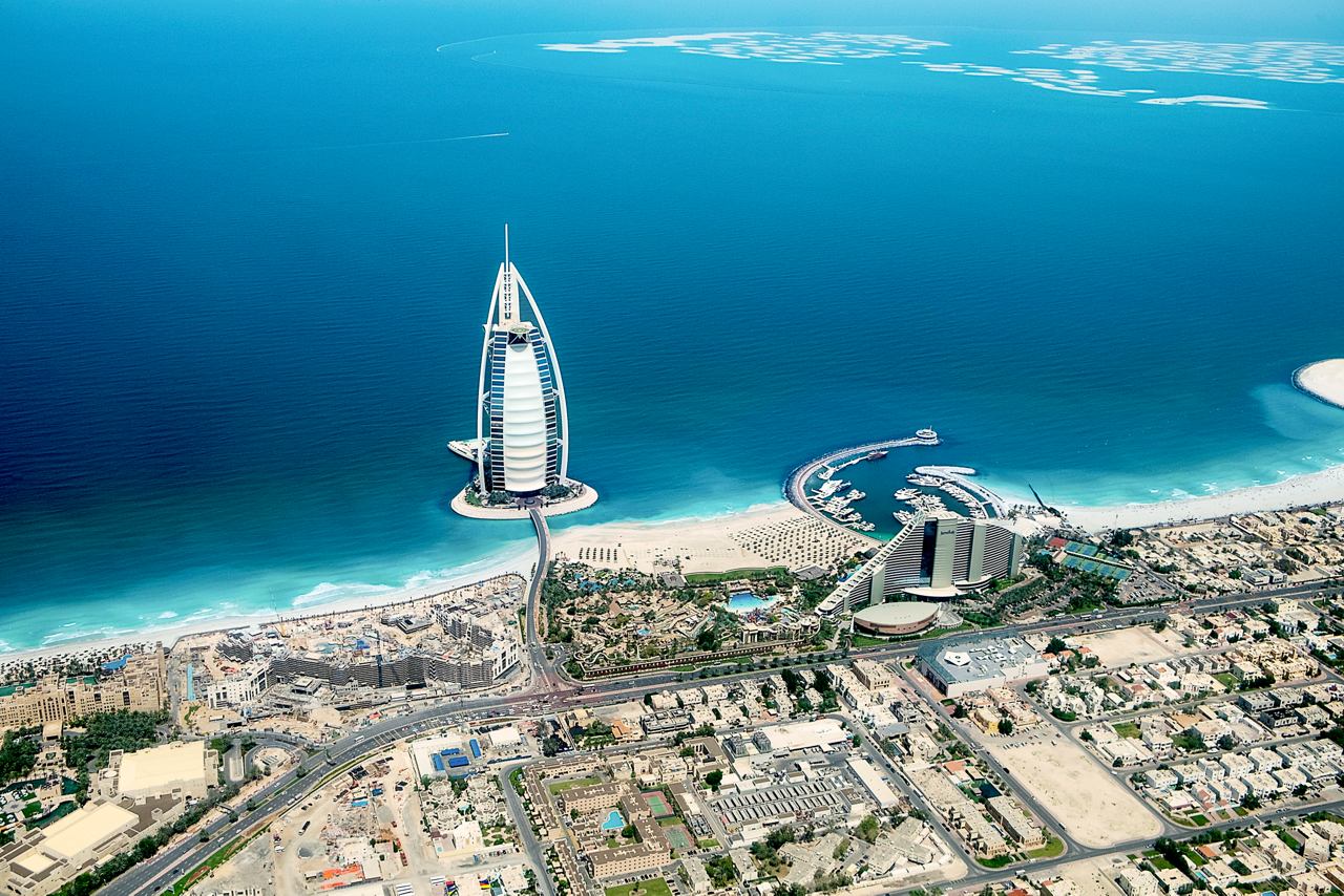 A breathtaking aerial view of Dubai's skyline and coastline showcasing the vibrant sea and modern architecture | MSC Cruises