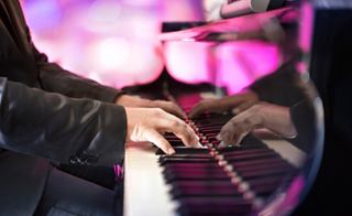 A musician plays the piano with skill and passion, creating a vibrant atmosphere of entertainment | MSC Cruises
