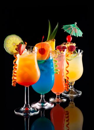 A vibrant selection of cocktails with fruit garnishes, ready to refresh and delight guests | MSC Cruises
