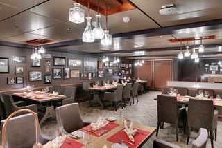 A stylish restaurant setting with elegant furnishings invites guests to enjoy a memorable dining experience | MSC Cruises