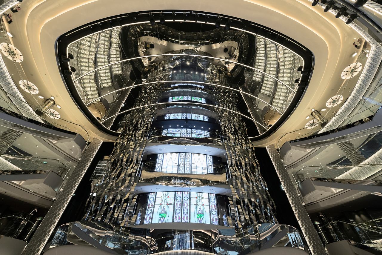 A stunning view of the atrium showcasing elegant design and modern architecture aboard MSC Seaside | MSC Cruises