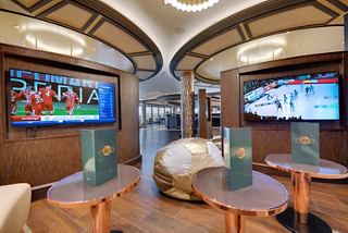 A stylish sports bar featuring comfortable seating, multiple TVs, and a welcoming atmosphere for relaxation | MSC Cruises