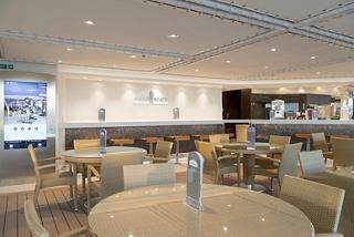 A welcoming lounge area featuring comfortable seating and a stylish bar counter | MSC Cruises