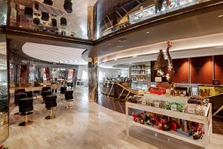 A vibrant bar area on MSC Seaside features stylish decor and inviting seating for guests to enjoy | MSC Cruises