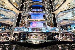 The elegant atrium of MSC Seaside features a vibrant bar area with modern LED displays and a welcoming atmosphere | MSC Cruises