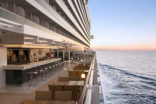 A stunning view of the outdoor Marketplace Bar on MSC Seaside, overlooking the endless sea | MSC Cruises