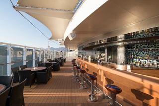 A stylish bar area on MSC Splendida with seating and a welcoming atmosphere for relaxation and socialising | MSC Cruises