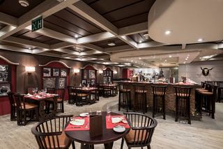 A modern restaurant with a warm atmosphere, ready to offer unique culinary experiences | MSC Cruises