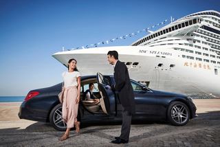 A couple enjoys a private transfer with a crew member by the MSC Splendida, creating memorable moments together | MSC Cruises