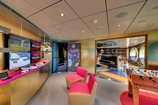 A vibrant teen club on MSC Seaview featuring gaming stations, seating areas, and a lively atmosphere for young guests | MSC Cruises