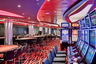 Luxurious indoor pool surrounded by lounge chairs | MSC Cruises