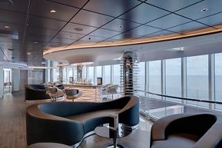 Guests enjoying cocktails at a panoramic rooftop bar | MSC Cruises