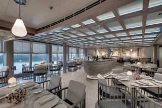 A bright and spacious restaurant aboard MSC Seaview, featuring elegant decor and ocean views | MSC Cruises