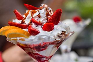 A delightful dessert featuring strawberries, chocolate, cream, and orange in a special gelato cup | MSC Cruises