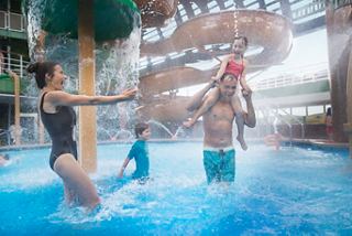 Children enjoying the fun at the Forest Aquaventure Park pool on MSC Seaview, splashing and playing together | MSC Cruises