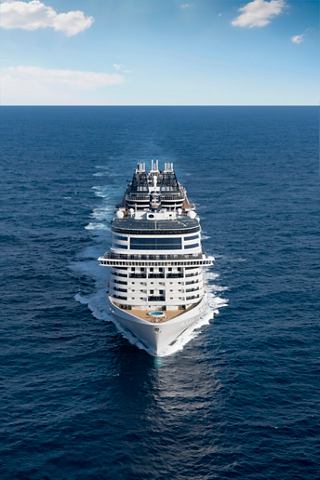 Aerial view of the MSC Bellissima sailing on open waters under a clear sky | MSC Cruises