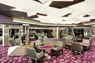 Elegant seating area in the Champagne Bar, inviting guests to relax and enjoy a refined atmosphere | MSC Cruises