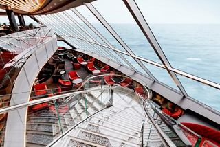 A stunning view from the Top Sail Lounge showcasing the luxurious MSC Yacht Club on MSC Grandiosa | MSC Cruises