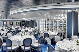 Elegant dining area in the main restaurant aboard MSC Grandiosa, featuring tables set for a delightful meal | MSC Cruises